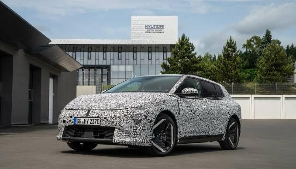 Kia EV4 concept vehicle front design with futuristic headlights